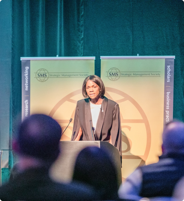 Woman speaking in front of audience