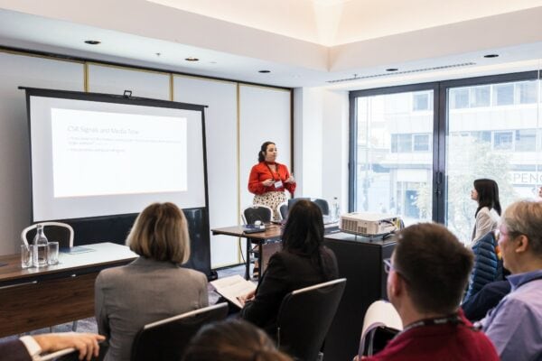 Woman presenting to audience in the office