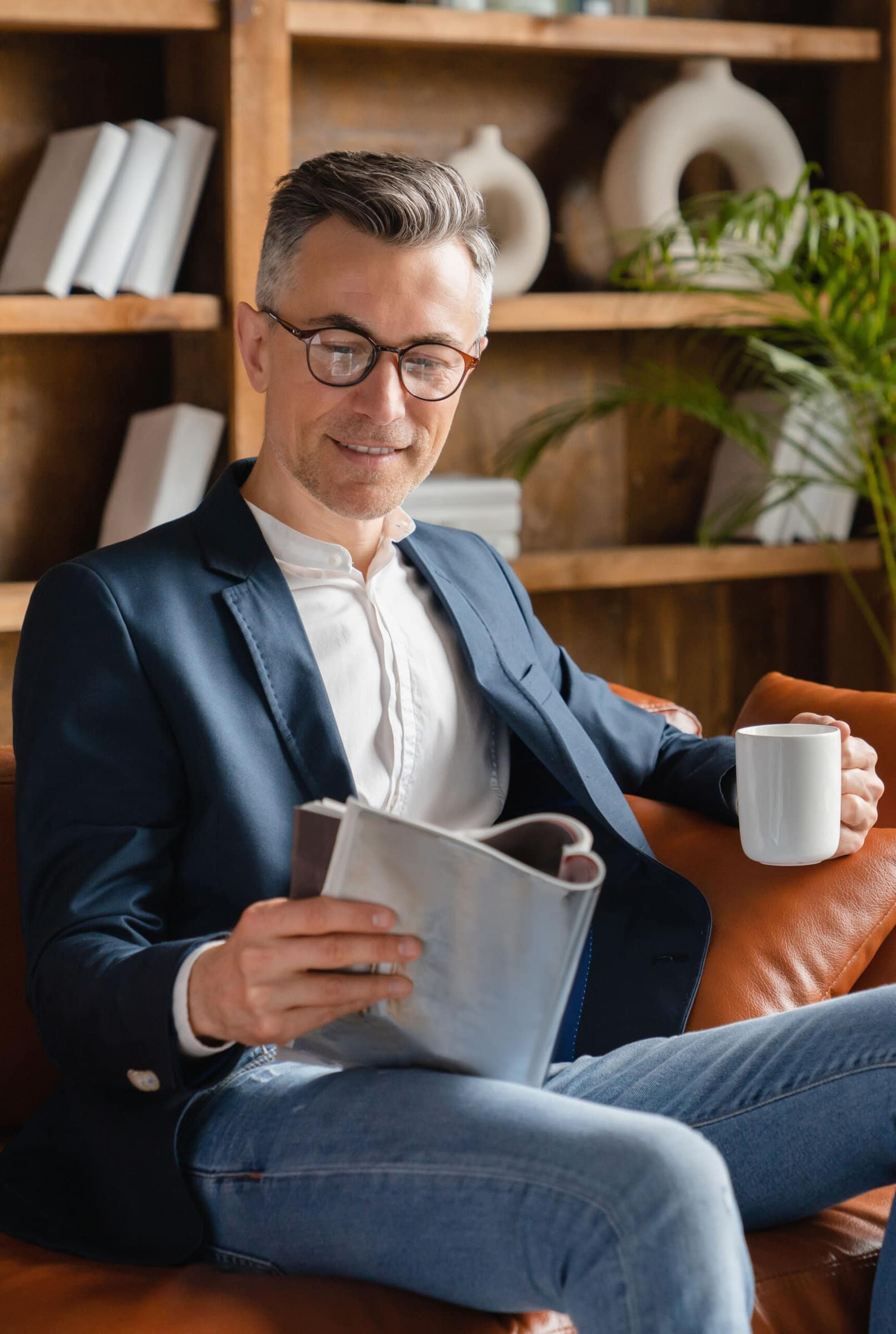 middle aged man reading a magazine middle aged man reading a magazine