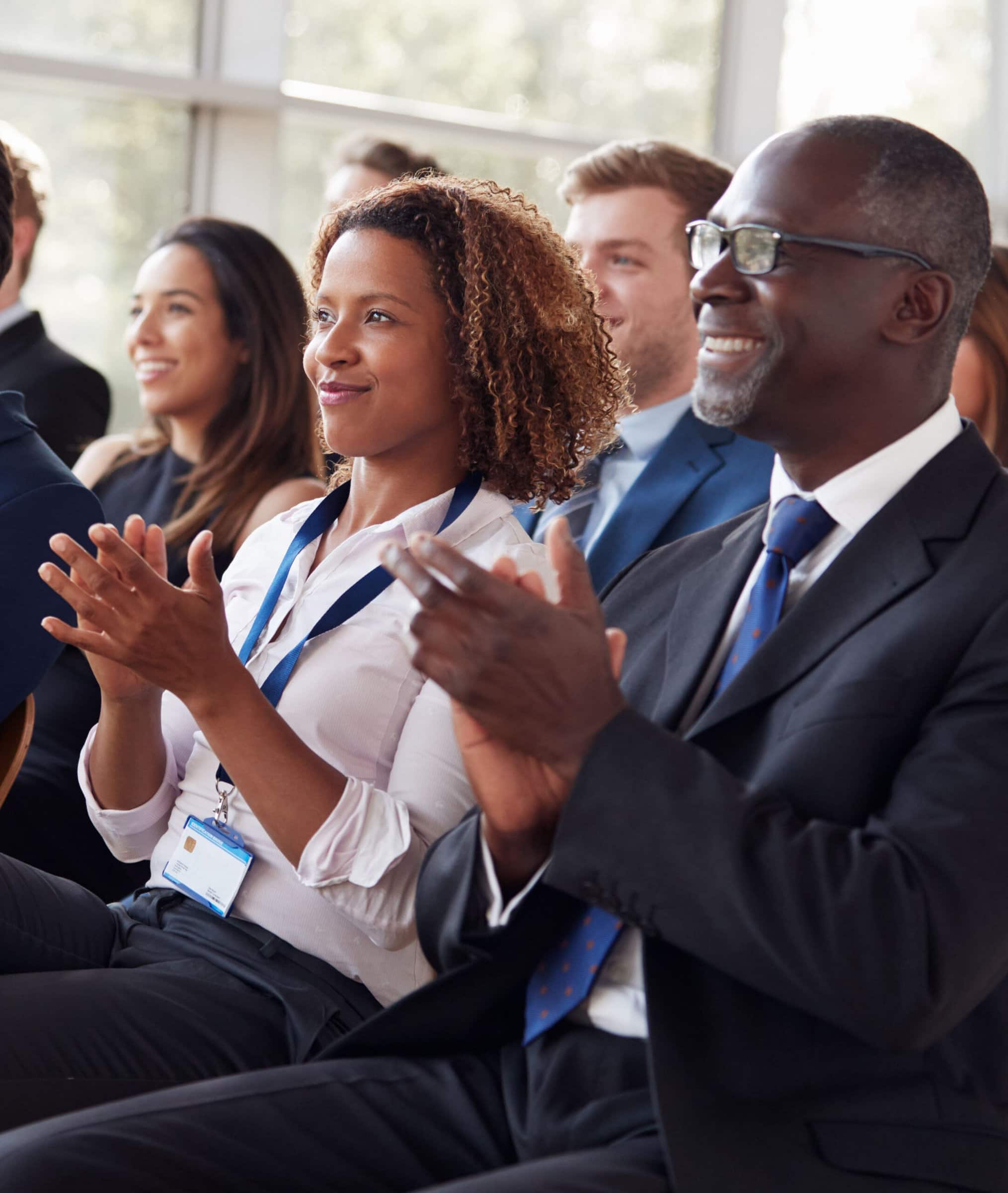 corporate people applauding during a conference