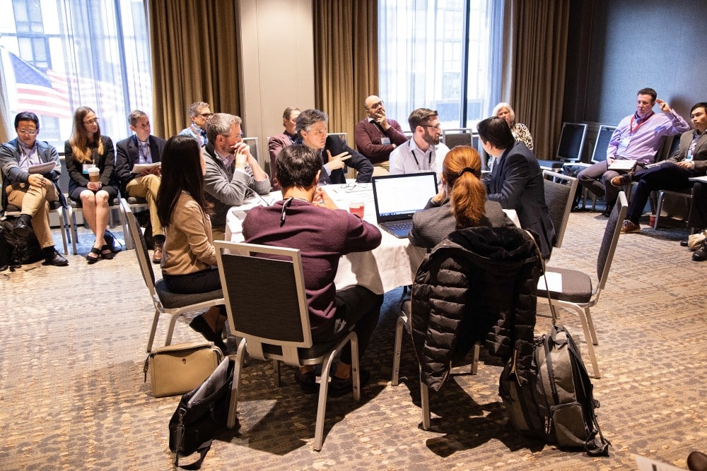 Members collaborating around the table.