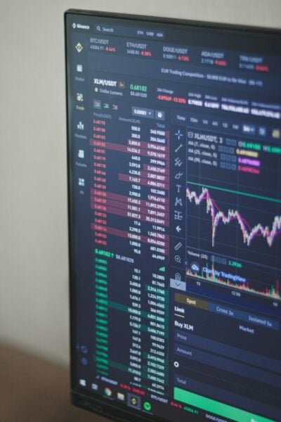 black flat screen computer monitor with stock exchange graph
