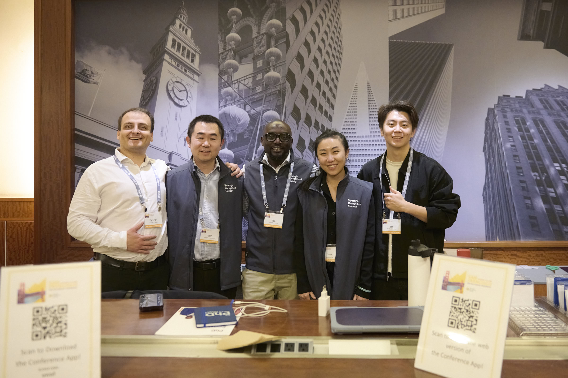 PhD student volunteers smiling at the Annual Conference in San Francisco