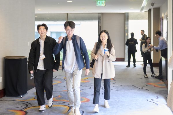 PhD students walking at conference
