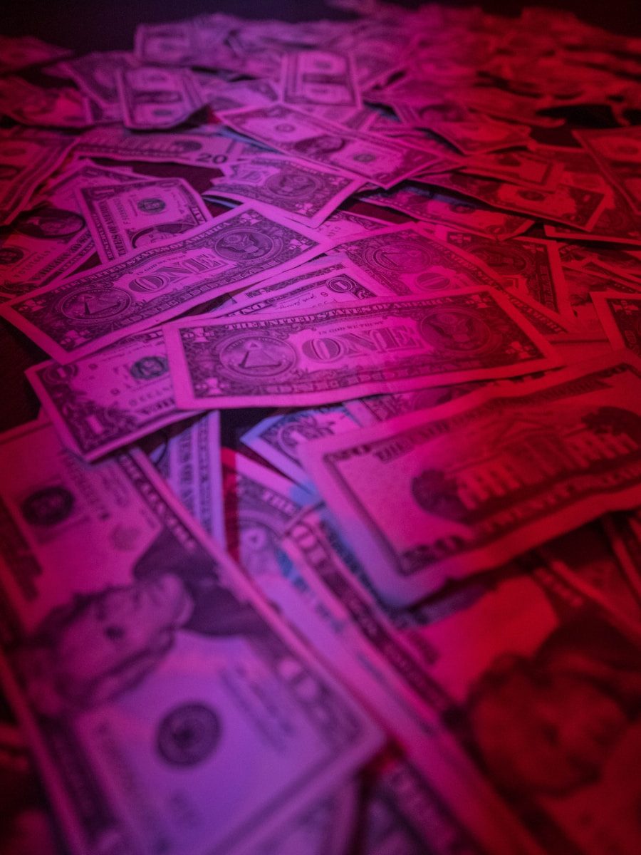 a pile of money sitting on top of a table